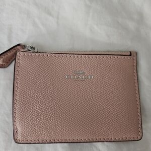 Never used Coach pink thin wallet.